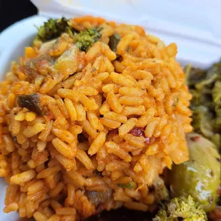 a plate of rice and broccoli