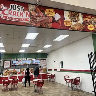 two people standing in front of a fast food restaurant