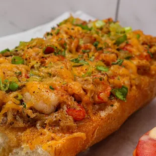 a sandwich and a pickle on a napkin