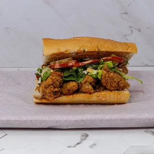 a sandwich with meat and lettuce