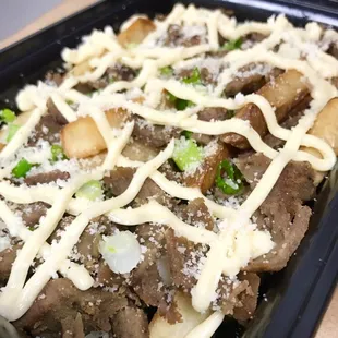 Loaded Truffle Fries: Hand Cut Fries, Truffle Beef, Spring Onions, Parmesan Cheese and Truffle Dressing! Boom!