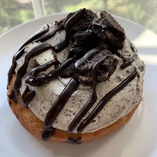 a frosted donut on a plate