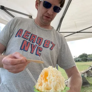 a man holding a plate of food
