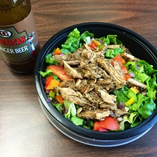 Chicken salad with spicy sauce and peppers, onion, and tomato, and a ginger beer. The picture says it all - fresh and colorful!