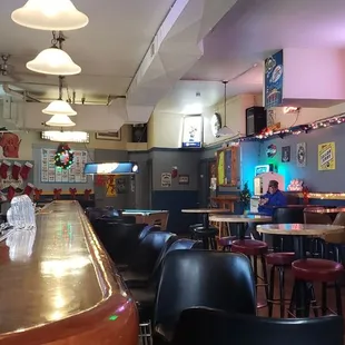 a restaurant with a long bar