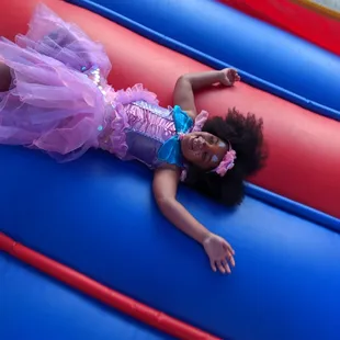 Happy birthday girl in her own private bounce house!