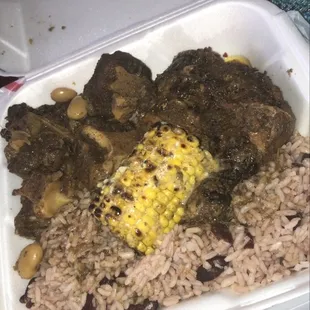 Oxtails. Jerk chicken. Rice and corn