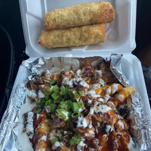 a tray of food and a roll