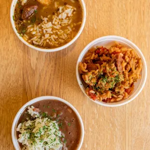 three bowls of food on a table