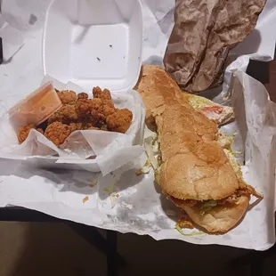 Soft shell crab poboy and gator bites fries were in the brown bag!