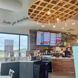 Entryway with the ceiling that looks like a big waffle and a view of their menu.