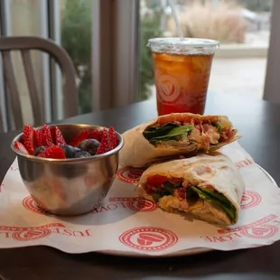 a sandwich and a bowl of fruit