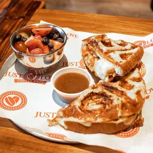 a sandwich and a bowl of fruit