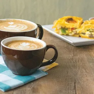 two cups of coffee on a table