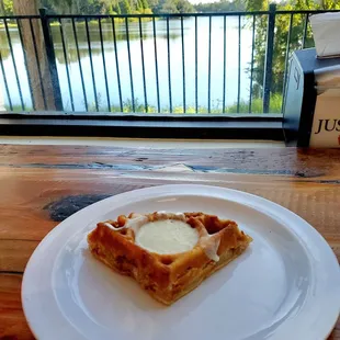 Apple cinnamon scone shaped like a waffle. Warm and delicious with cream cheese frosting. Yum!