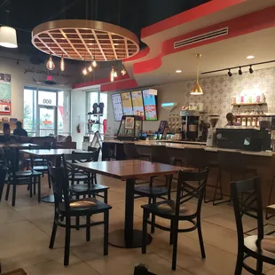 Cool chandelier with a variety of seating options - couches, bar seating at the counter/next to the window, &amp; tables that seat 2 or 4.