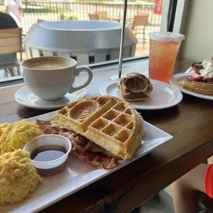 Breakfast platter, cinnamon roll waffle, Nutella waffle, white chocolate tiramisu coffee, and strawberry dragon.