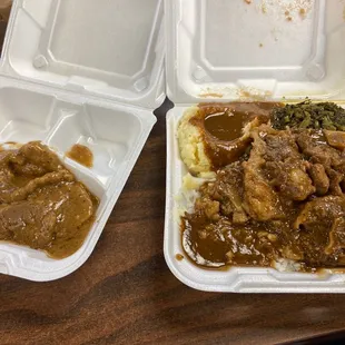 Smothered Pork Chop, Oxtails, Mashed Potatoes, Mustard Greens and White Rice