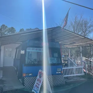 a bus parked in front of a bbq