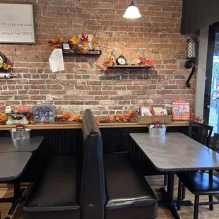 a brick wall and tables