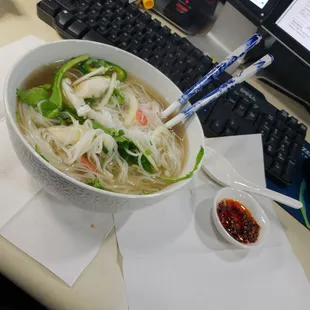 Nothing like seafood Phó and hot chili sauce at your workstation !