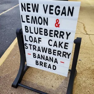 a sign on a sidewalk