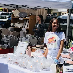 a woman selling pies