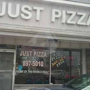 a car parked in front of a restaurant