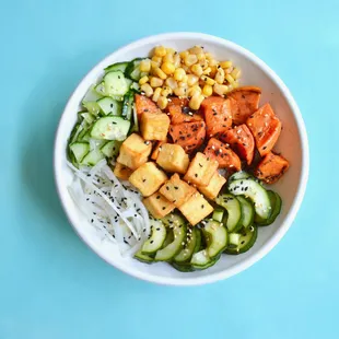 a bowl of food on a blue surface