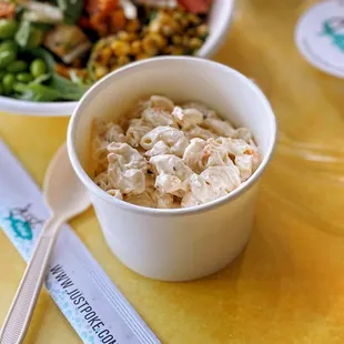 a bowl of food and a spoon on a table