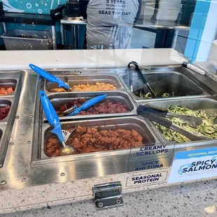 a variety of food items in a buffet