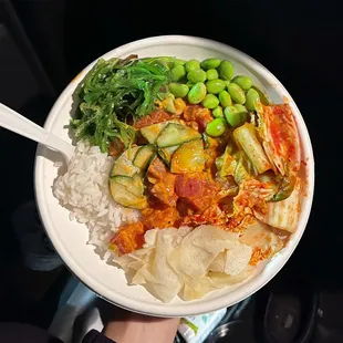 spicy ahi bowl with added sriracha honey, the normal toppings it comes with plus spicy crab, edamame, kimchi and seaweed salad