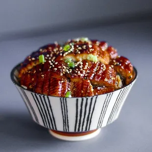 a bowl of food with sesame seeds