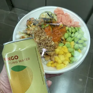 Customized poke bowl and a mango sparking water.