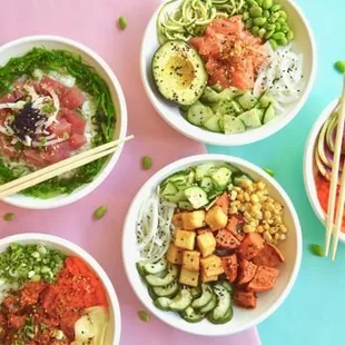 a variety of poke bowls