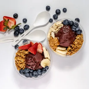 two bowls of yogurt and berries