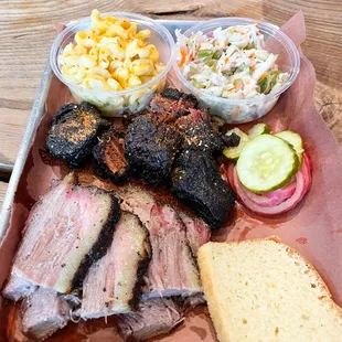 Brisket and burnt ends with sides of mac and coleslaw.