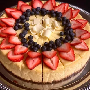  cake decorated with strawberries and blueberries