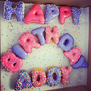 a box of happy birthday donuts