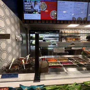 a variety of food in a display case