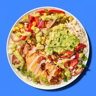 a plate of chicken, rice, and vegetables