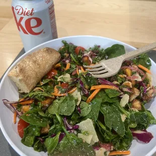 a can of diet coke and a salad