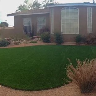 a front yard with artificial grass