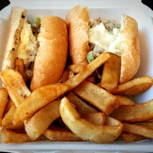 Steak, mushrooms, grilled onions, green peppers (not pickled peppers that some use), provolone cheese &amp; seasoned steak fries.