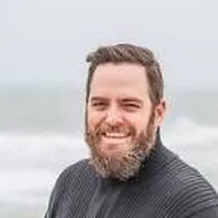 a man standing on the beach