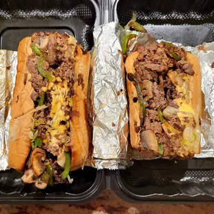 The ribeye steak and cheese sub with green peppers, mushrooms, lettuce, tomatoes, and grilled onions.