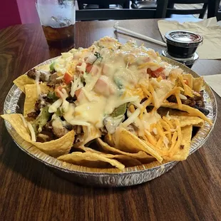 Nachos with Chipotle Black Beans with Campechano Sausage mixed with carne asada.