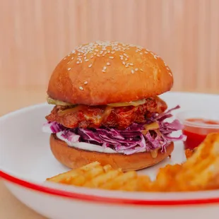 &quot;The Liz Bird&quot; Tindle fried chicken, &quot;honey&quot; mustard, cabbage, pickled cucumbers, and mayo on a brioche bun. Comes with waffle fries!