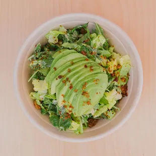 House Caesar salad: Organic Romaine lettuce, house made croutons, follow your heart parm, Caesar salad dressing and an avocado.
