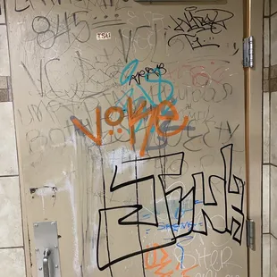 a door with graffiti on it